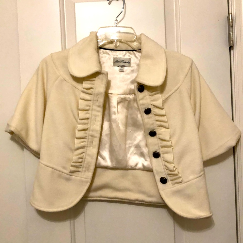 Cropped Cream Coat with flutter detail.